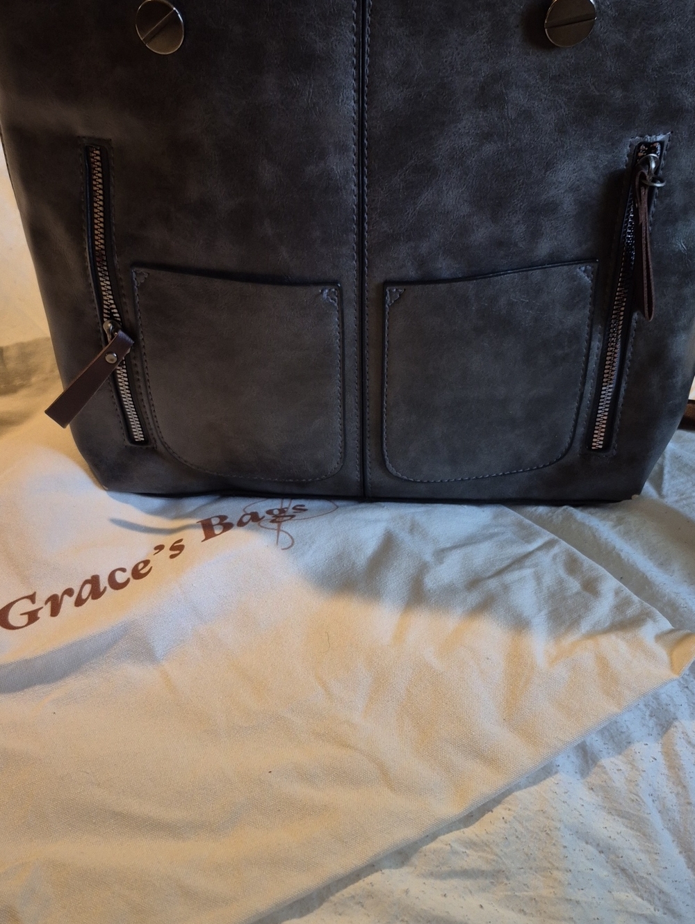 Black Womans Cross Bagwith Front Zip Pockets